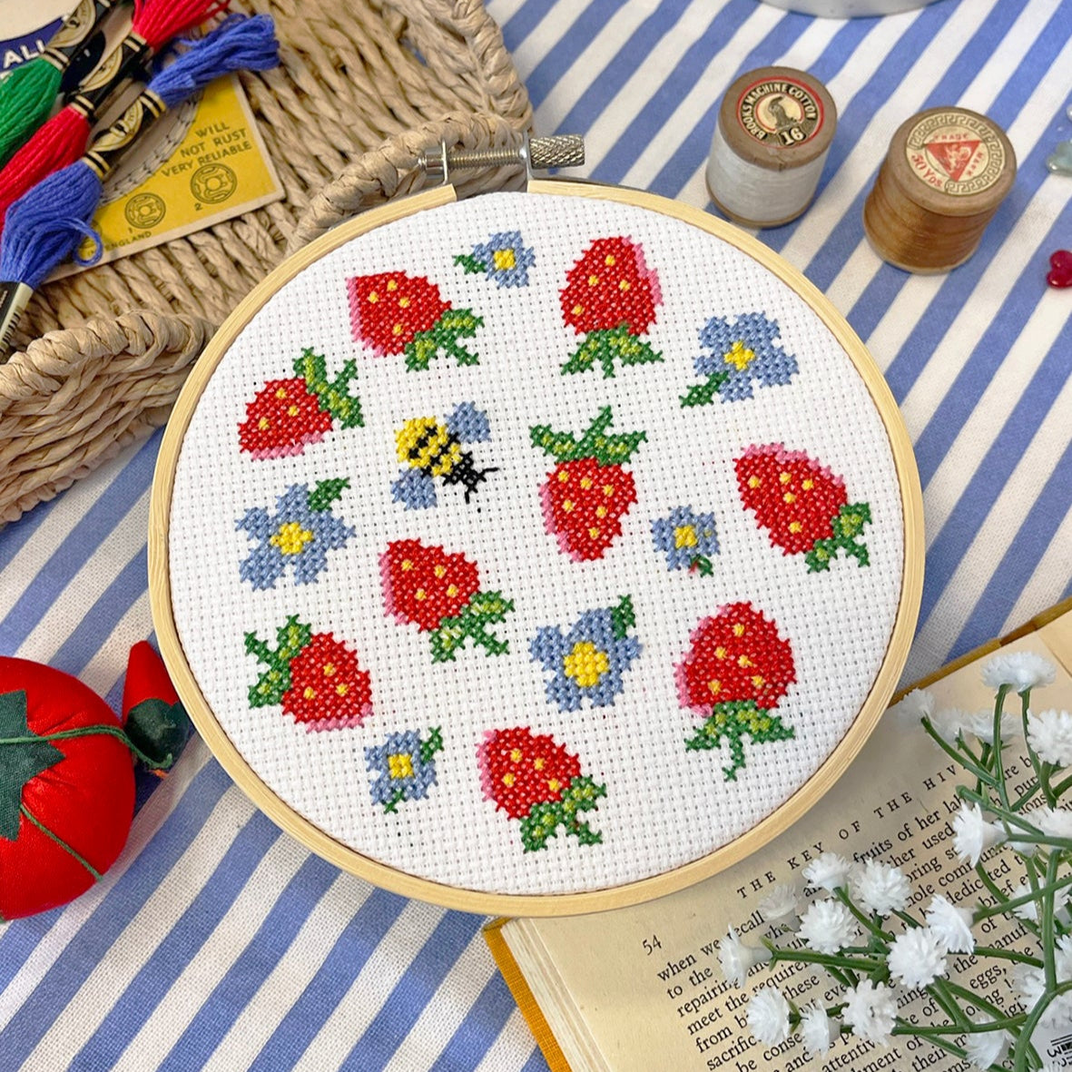 cross stitch design with strawberry motifs