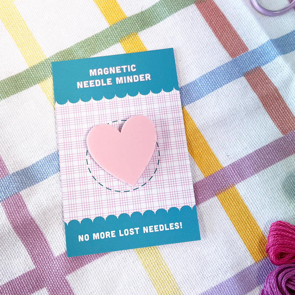 pink heart shaped needle minder